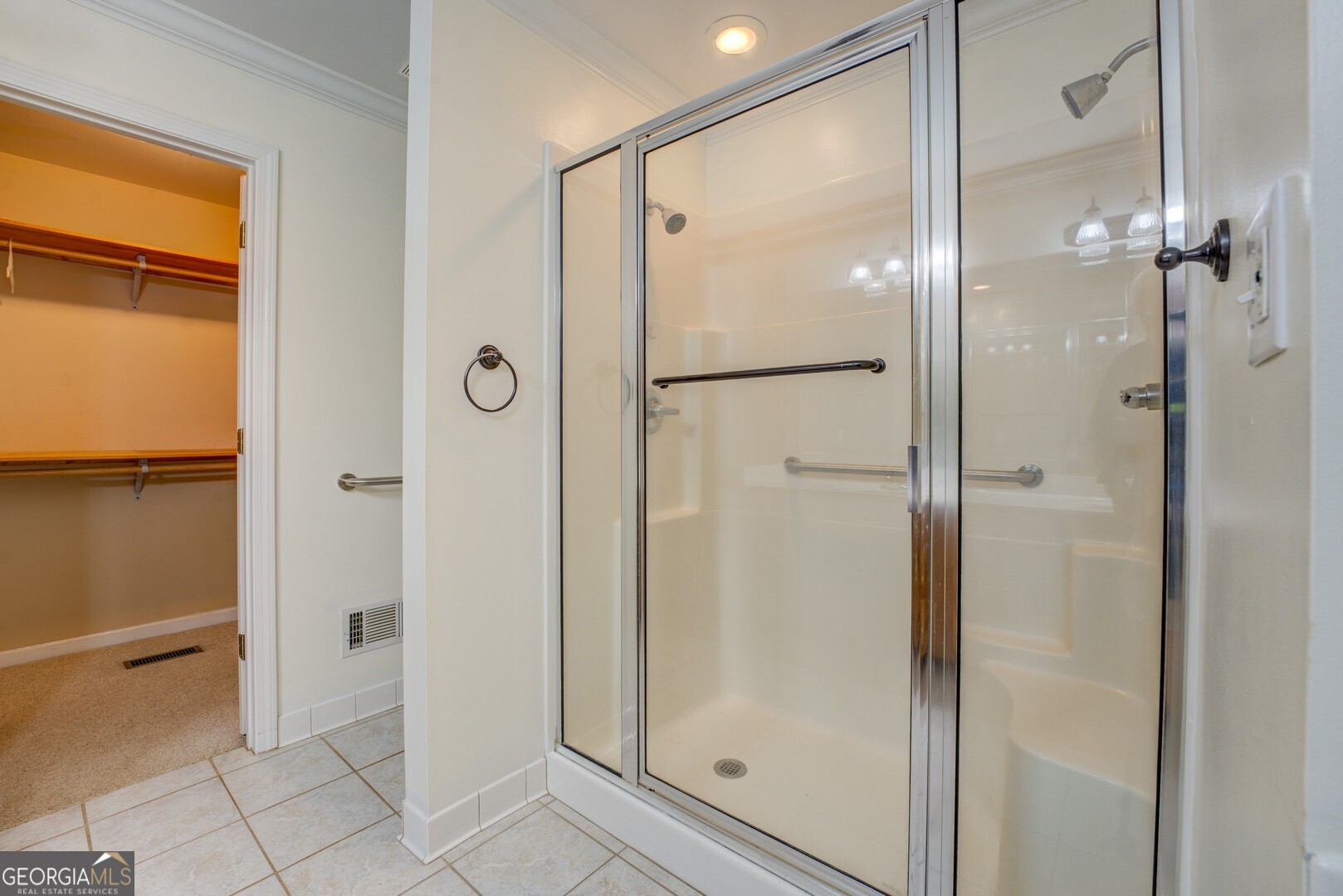 925 Highway 36 East Jackson, GA 30233 - Photo 39 of 90 a bathroom with a glass shower door and a glass door