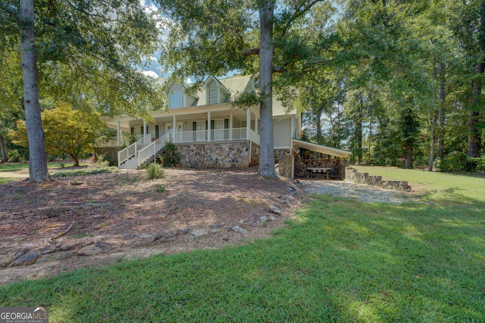 925 Highway 36 East Jackson, GA 30233 - Photo 4 of 90 a view of a house with backyard and a tree