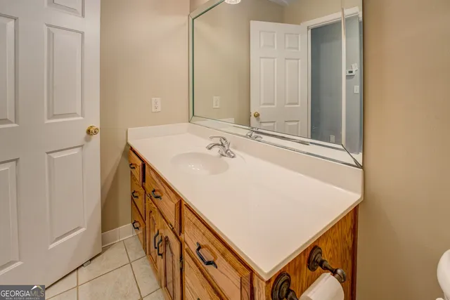 an aerial view of a houses with a yard and lake view