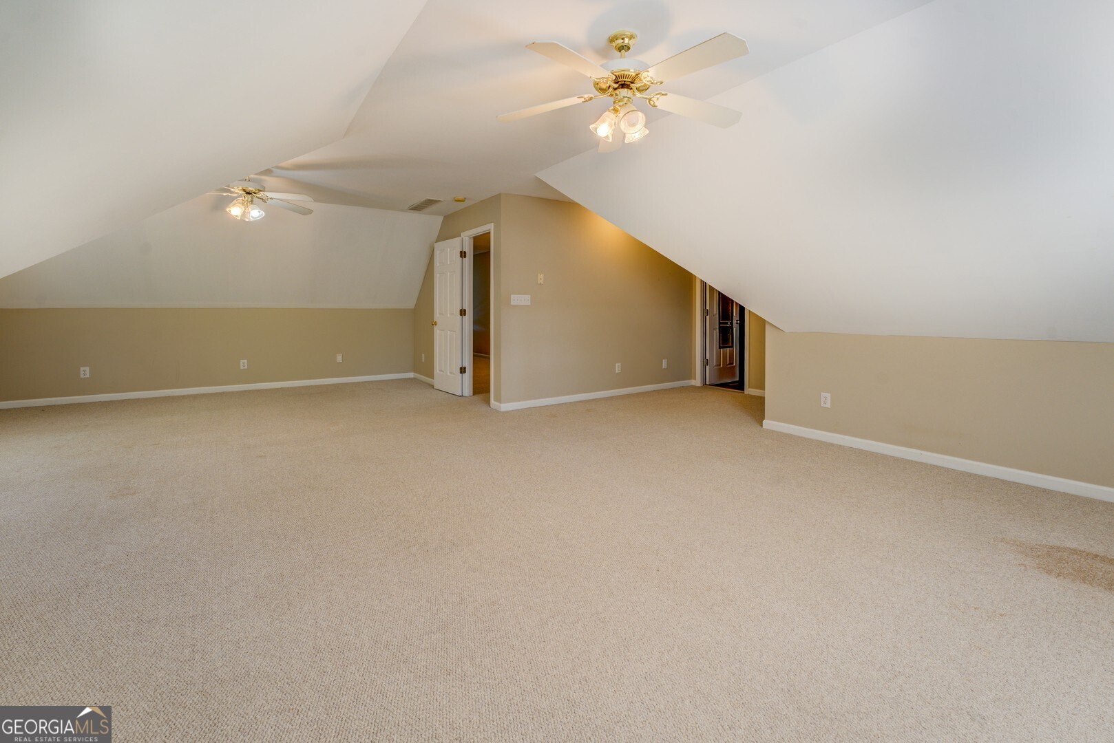 925 Highway 36 East Jackson, GA 30233 - Photo 47 of 90 an empty room with a ceiling fan and a fan
