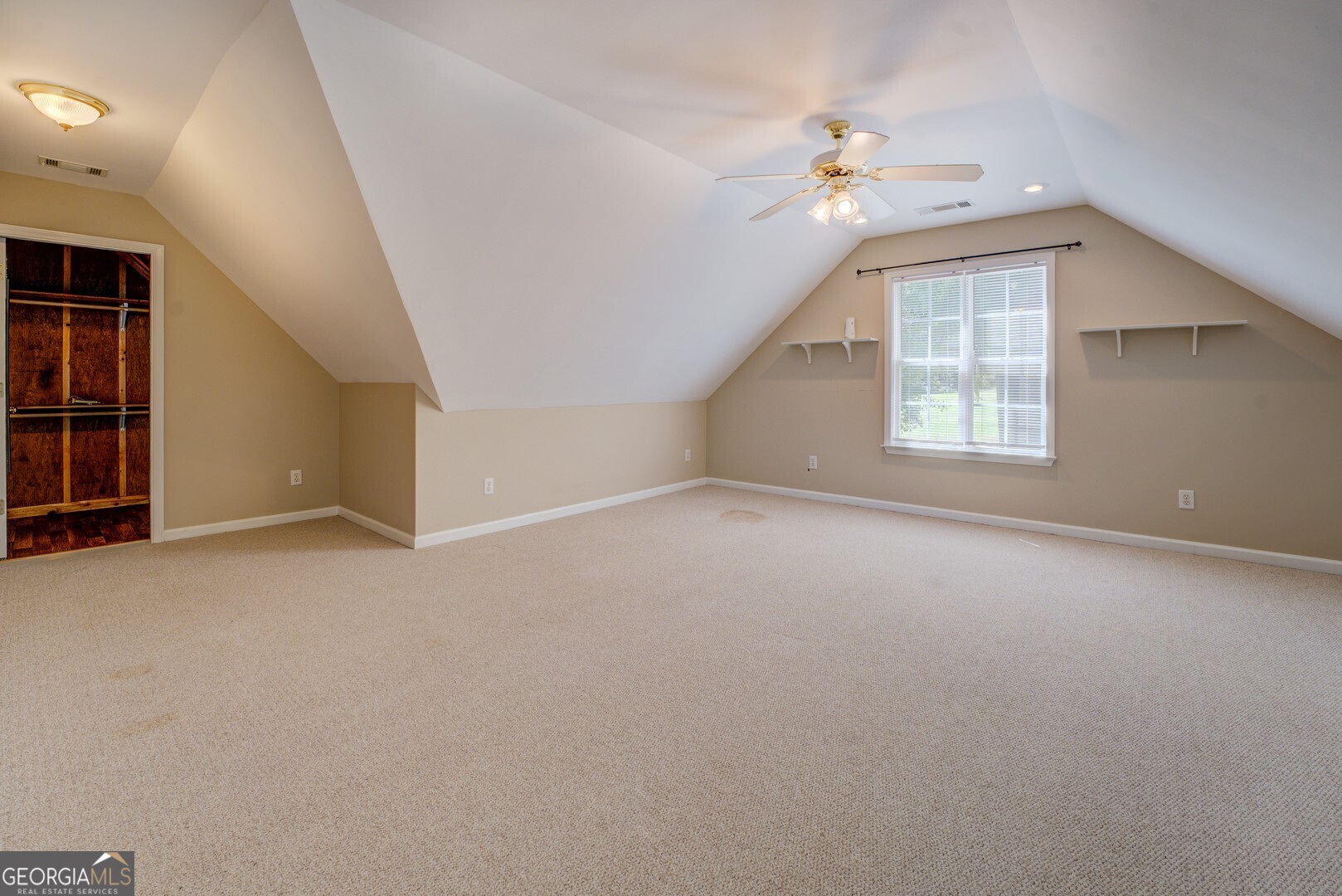 925 Highway 36 East Jackson, GA 30233 - Photo 48 of 90 an empty room with a ceiling fan and window
