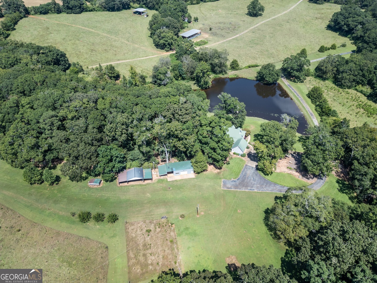 925 Highway 36 East Jackson, GA 30233 - Photo 64 of 90 an aerial view of a house with a yard and lake view