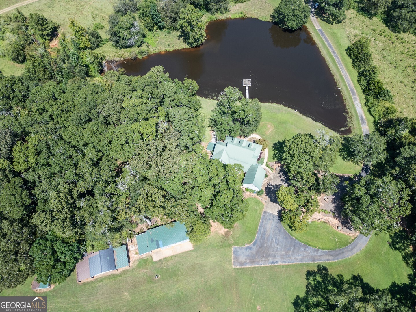 925 Highway 36 East Jackson, GA 30233 - Photo 70 of 90 an aerial view of a house with a yard and lake view