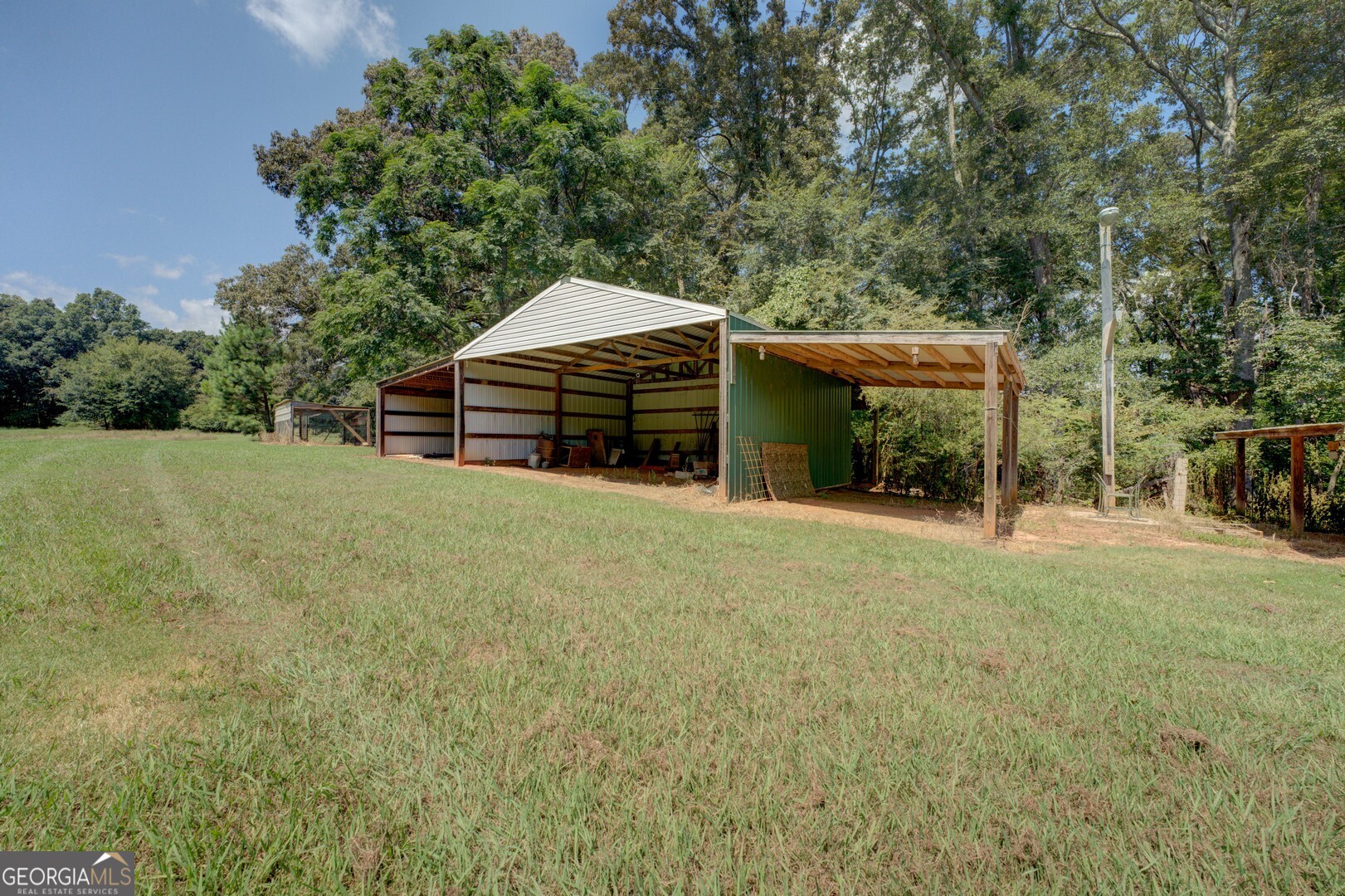 925 Highway 36 East Jackson, GA 30233 - Photo 8 of 90 a view of a house with a yard and sitting area