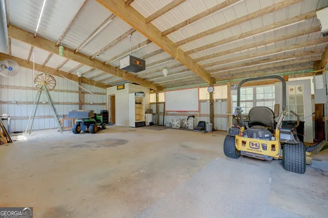an aerial view of a houses with a yard