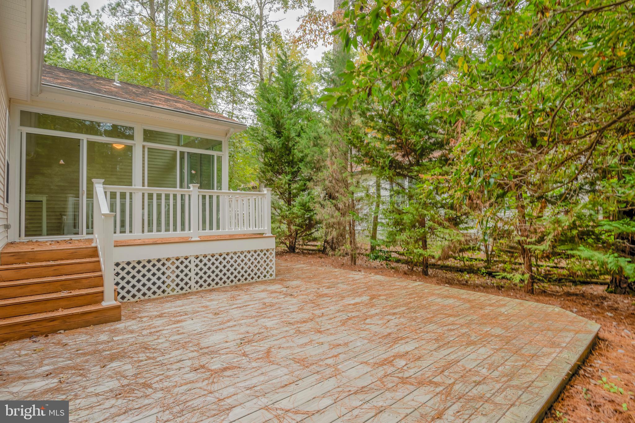 57 Sandyhook Road Ocean Pines, MD 21811 - Photo 17 of 52 Large rear ground level deck for outdoor enjoyment