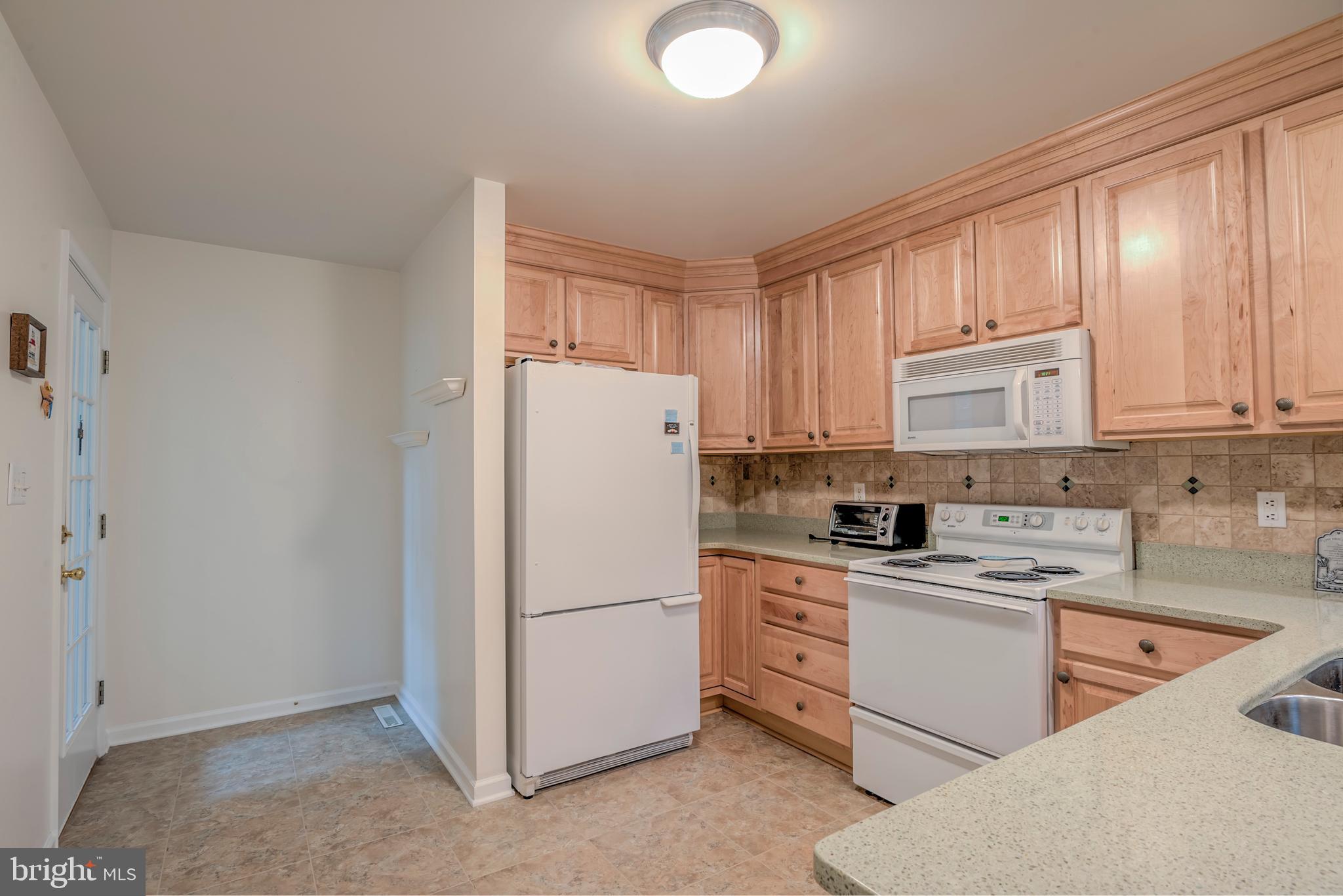 57 Sandyhook Road Ocean Pines, MD 21811 - Photo 21 of 52 Kitchen view to Sun Room door