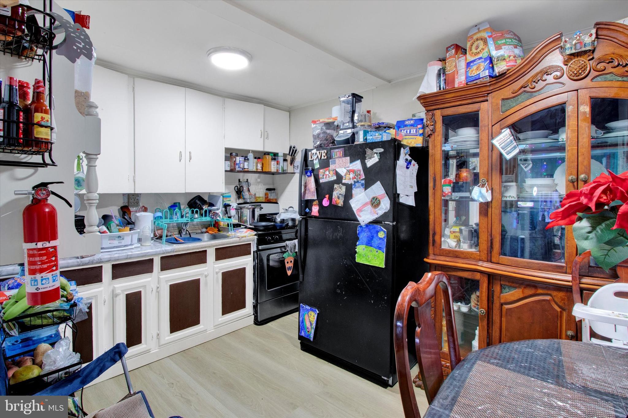 238 South 5th Street Reading, PA 19602 - Photo 11 of 28 a view of a kitchen with fridge and lots of stuff