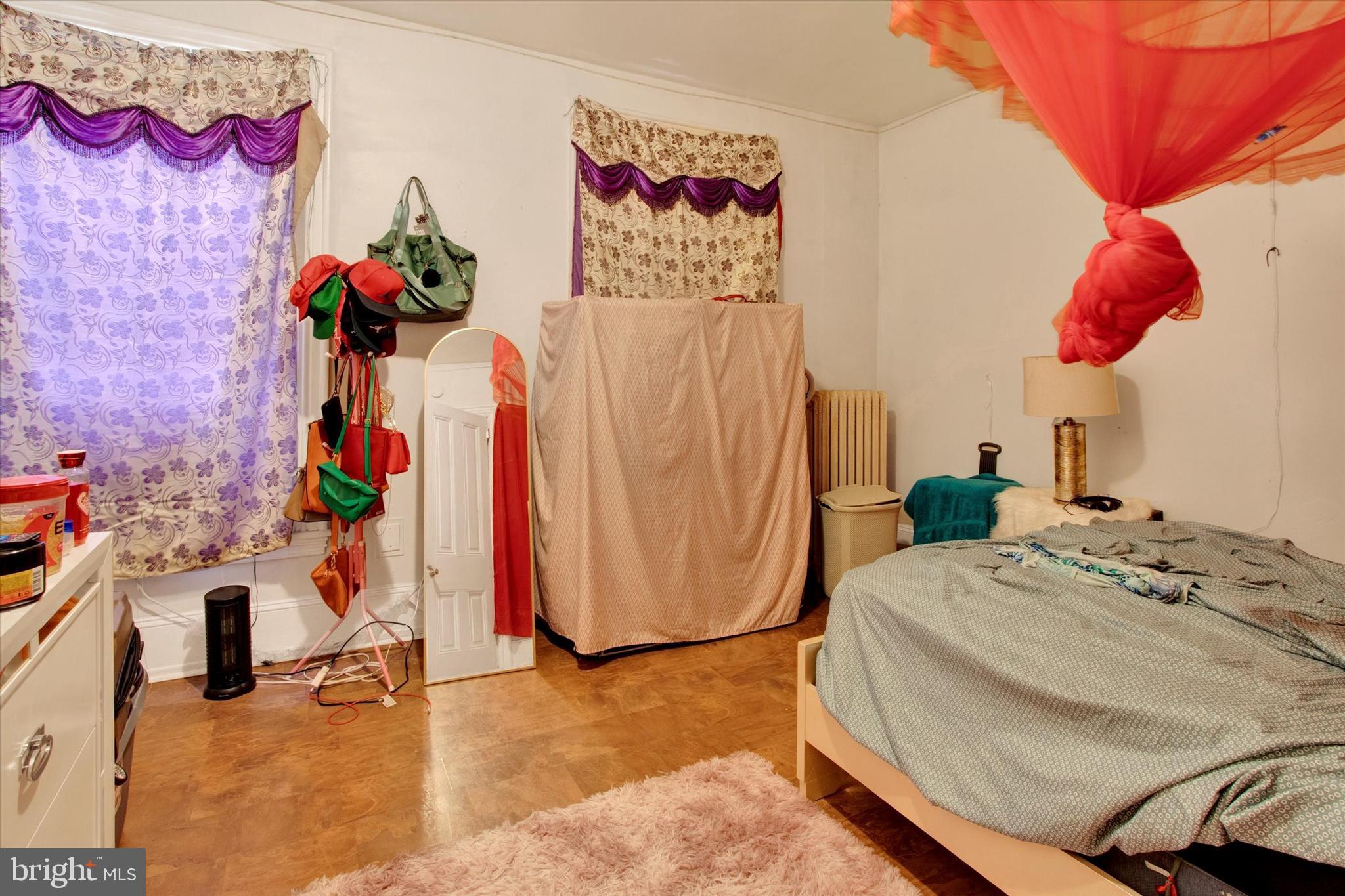 238 South 5th Street Reading, PA 19602 - Photo 17 of 28 a bedroom with a bed and a couch