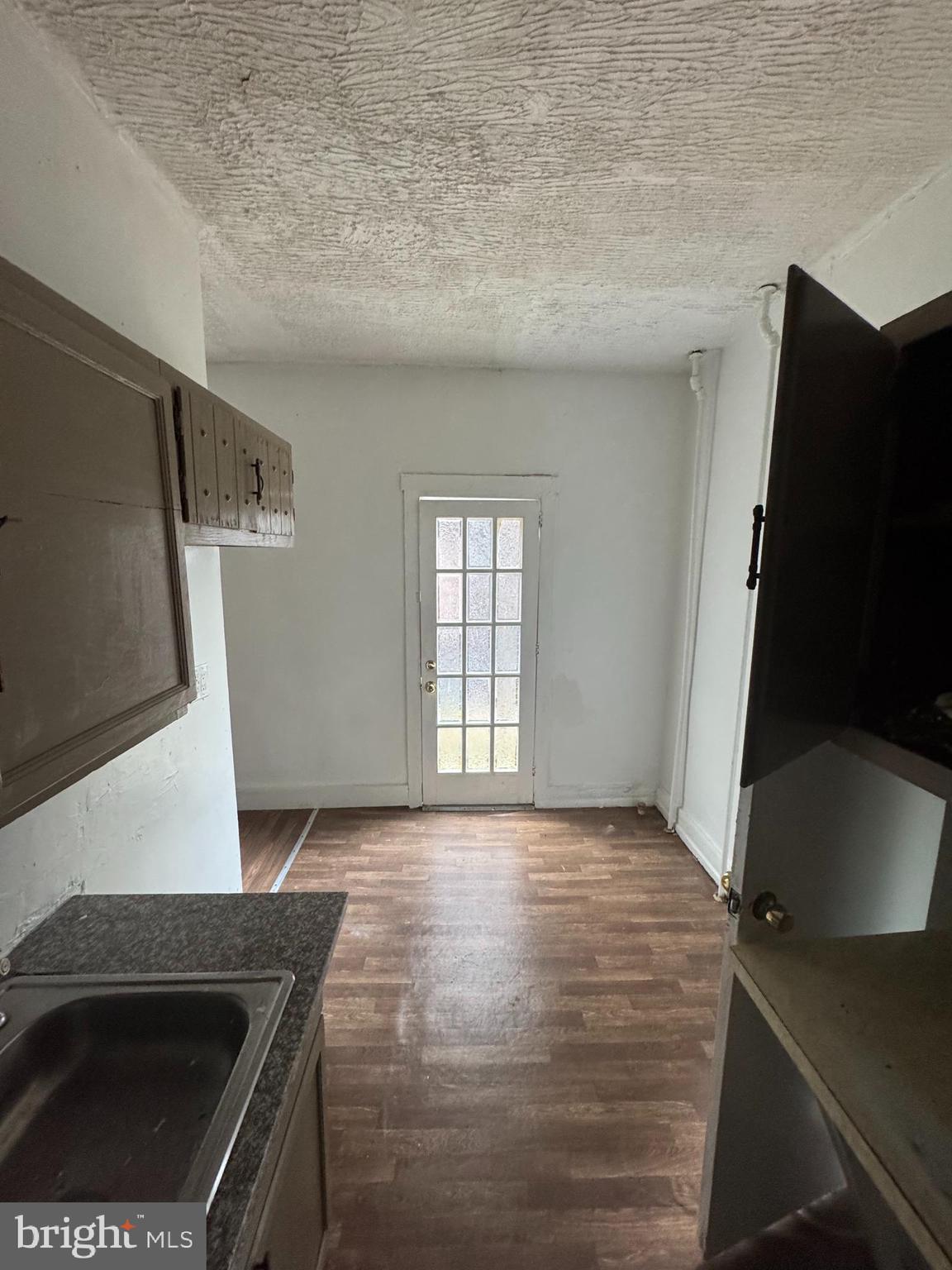 238 South 5th Street Reading, PA 19602 - Photo 21 of 28 a kitchen with a sink a stove and a microwave