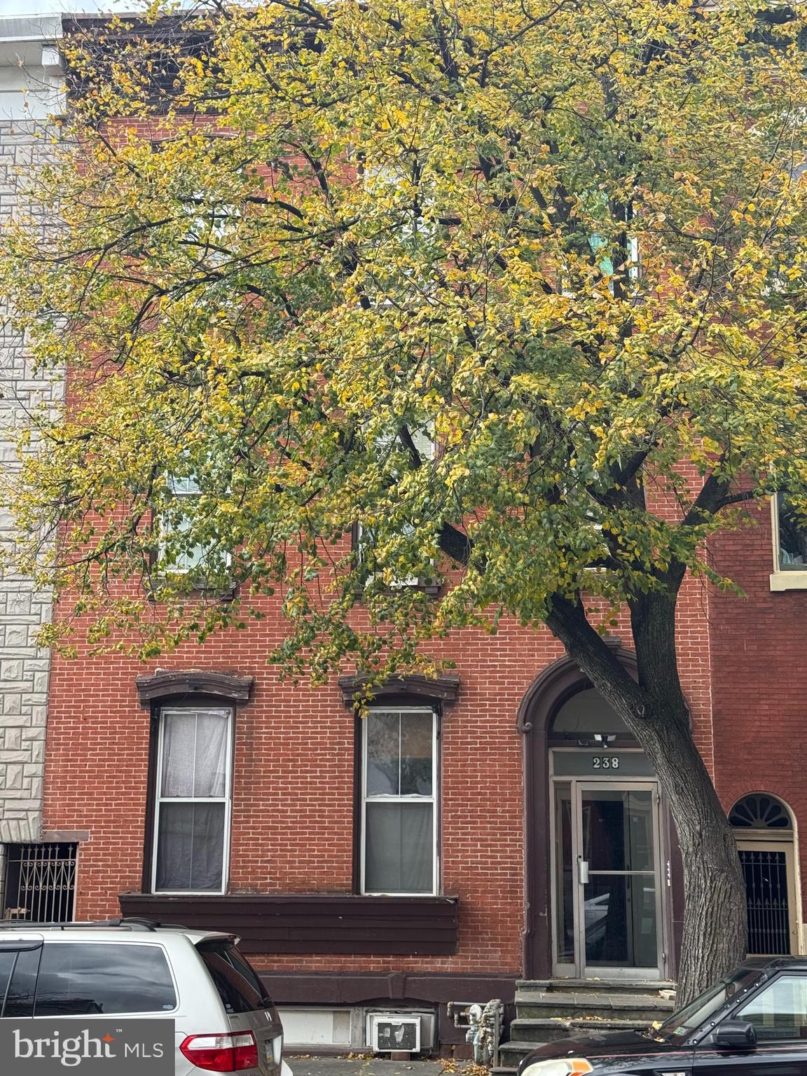 238 South 5th Street Reading, PA 19602 - Photo 25 of 28 a front view of a house with parking space