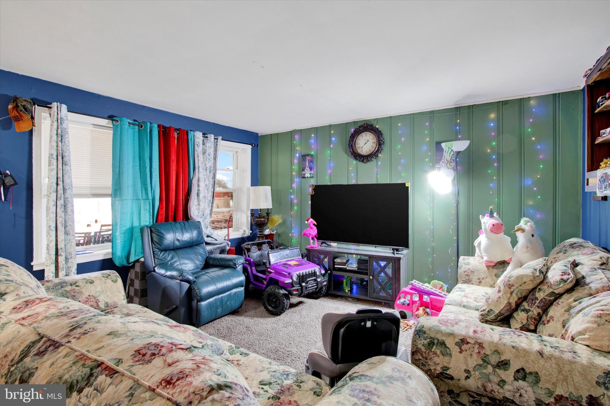238 South 5th Street Reading, PA 19602 - Photo 9 of 28 a living room with furniture and a flat screen tv