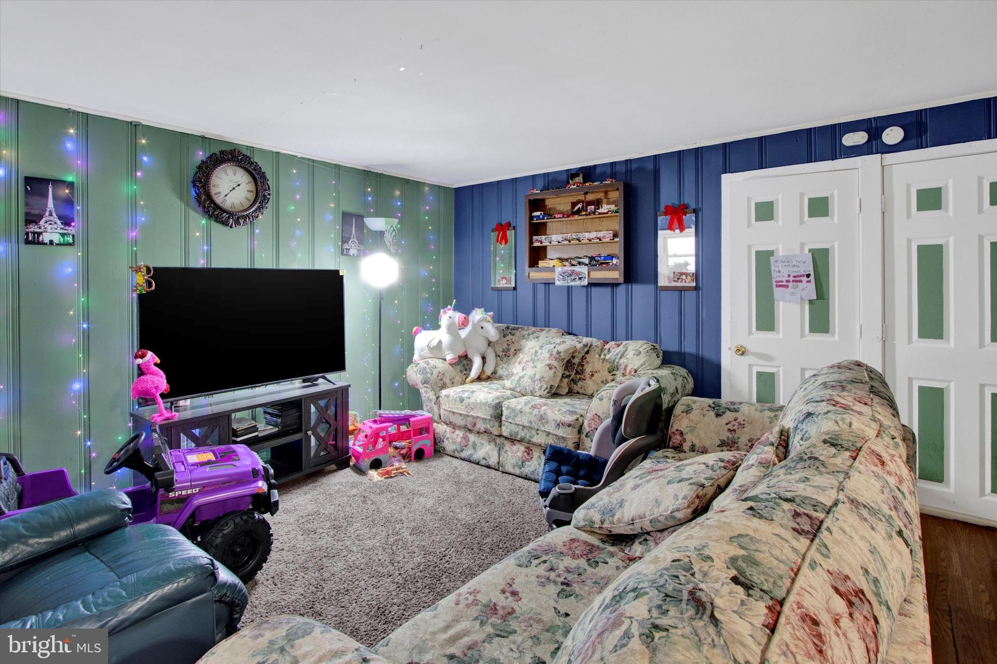 238 South 5th Street Reading, PA 19602 - Photo 10 of 28 a bedroom with furniture and a flat screen tv