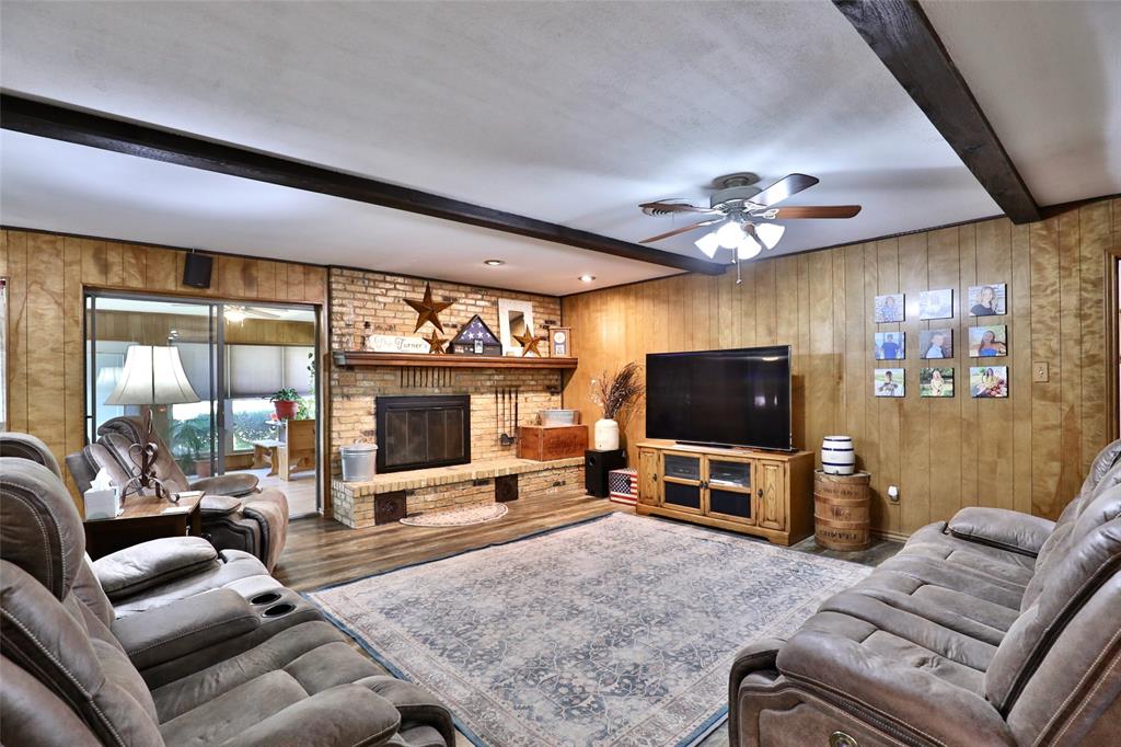 448 Elmdale Road South Abilene, TX 79602 - Photo 6 of 39 a living room with furniture and a flat screen tv