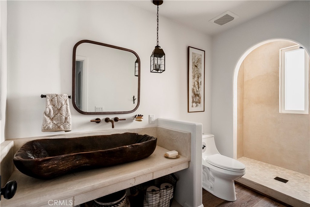 26868 Canyon End Road Canyon Country, CA 91387 - Photo 15 of 41 a bathroom with a sink a toilet and a mirror