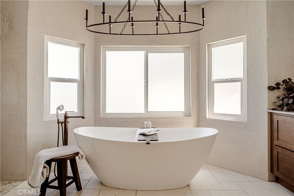 26868 Canyon End Road Canyon Country, CA 91387 - Photo 24 of 41 a white bath tub sitting in a bathroom next to a window
