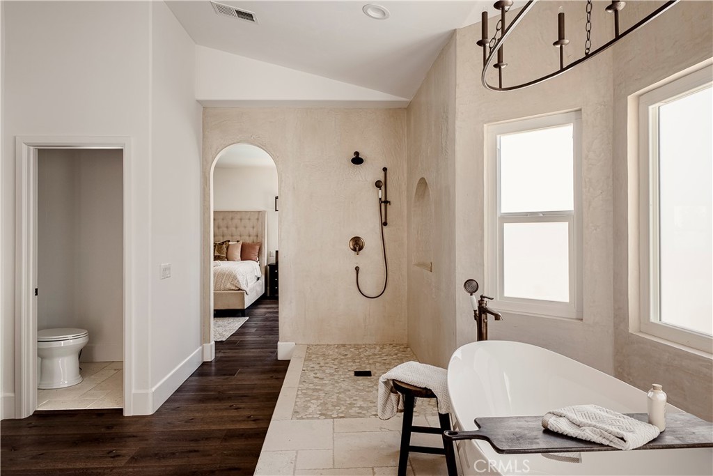 26868 Canyon End Road Canyon Country, CA 91387 - Photo 25 of 41 a spacious bathroom with a granite countertop sink a mirror and a shower