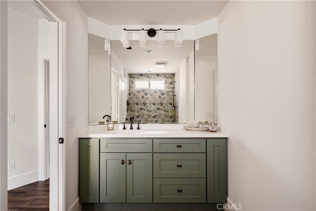 26868 Canyon End Road Canyon Country, CA 91387 - Photo 30 of 41 a bathroom with a sink double vanity and a mirror