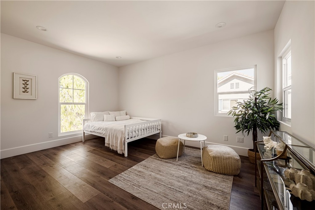 26868 Canyon End Road Canyon Country, CA 91387 - Photo 32 of 41 a spacious bedroom with a bed and a potted plant