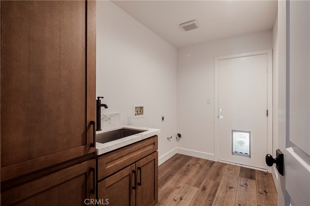 26868 Canyon End Road Canyon Country, CA 91387 - Photo 36 of 41 a view of storage and utility room with wooden floor