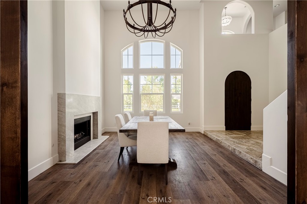 26868 Canyon End Road Canyon Country, CA 91387 - Photo 5 of 41 a living room with furniture a fireplace and a floor to ceiling window