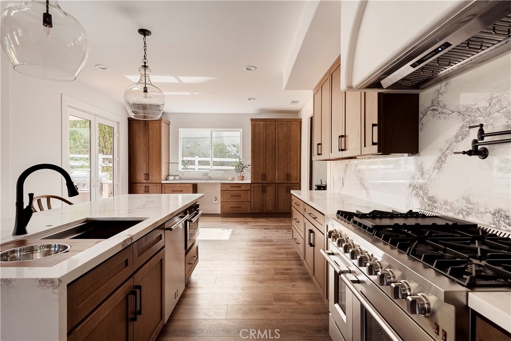 26868 Canyon End Road Canyon Country, CA 91387 - Photo 9 of 41 a kitchen with a stove and a sink