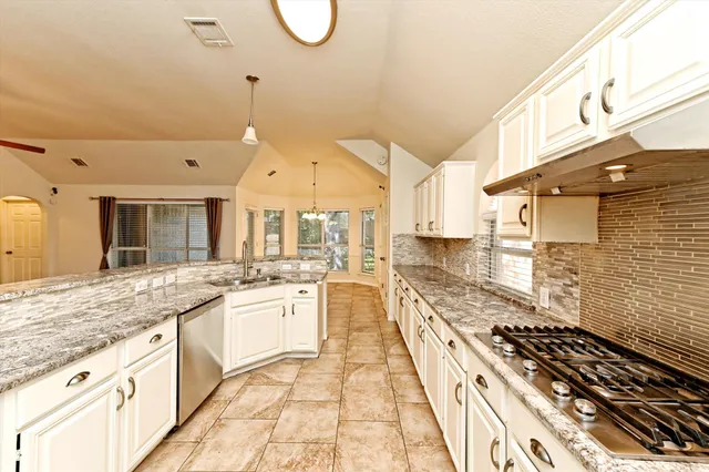 a view of a livingroom with a ceiling fan and window