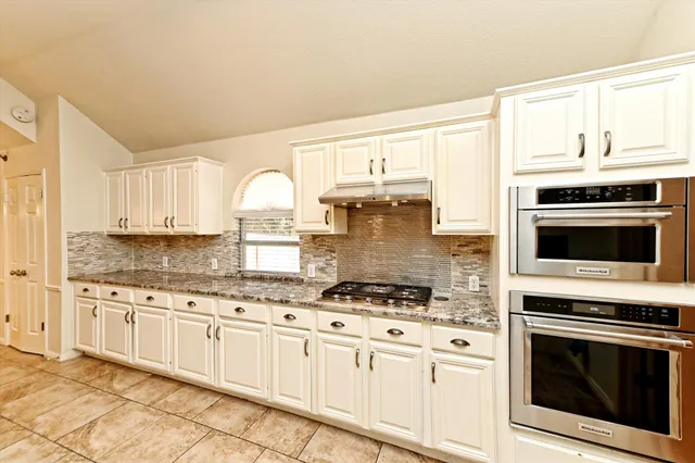 a spacious bathroom with a shower and a sink