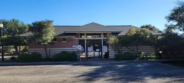 a view of a house with a tree