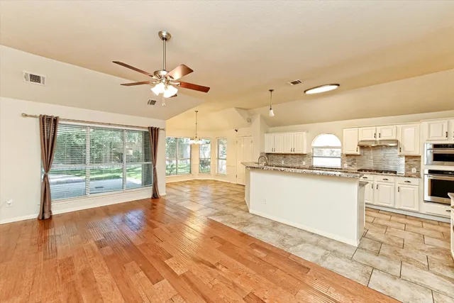 a view of kitchen with granite countertop cabinets and a counter top space