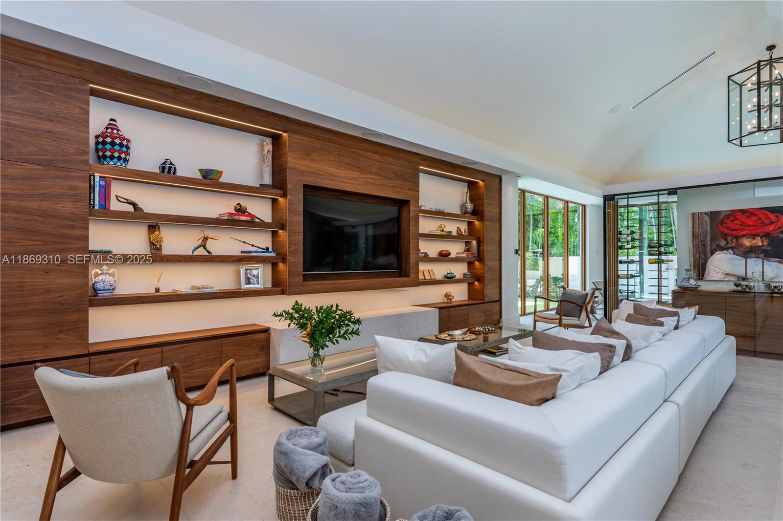 864 Northeast 84th Street Miami, FL 33138 - Photo 13 of 53 a living room with furniture kitchen view and a flat screen tv