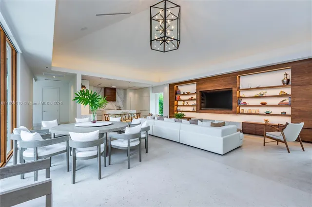 a view of a room with furniture and wooden floor