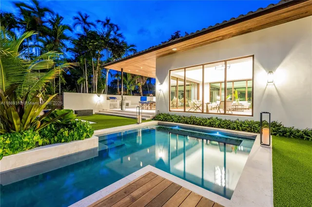 a view of swimming pool with chairs