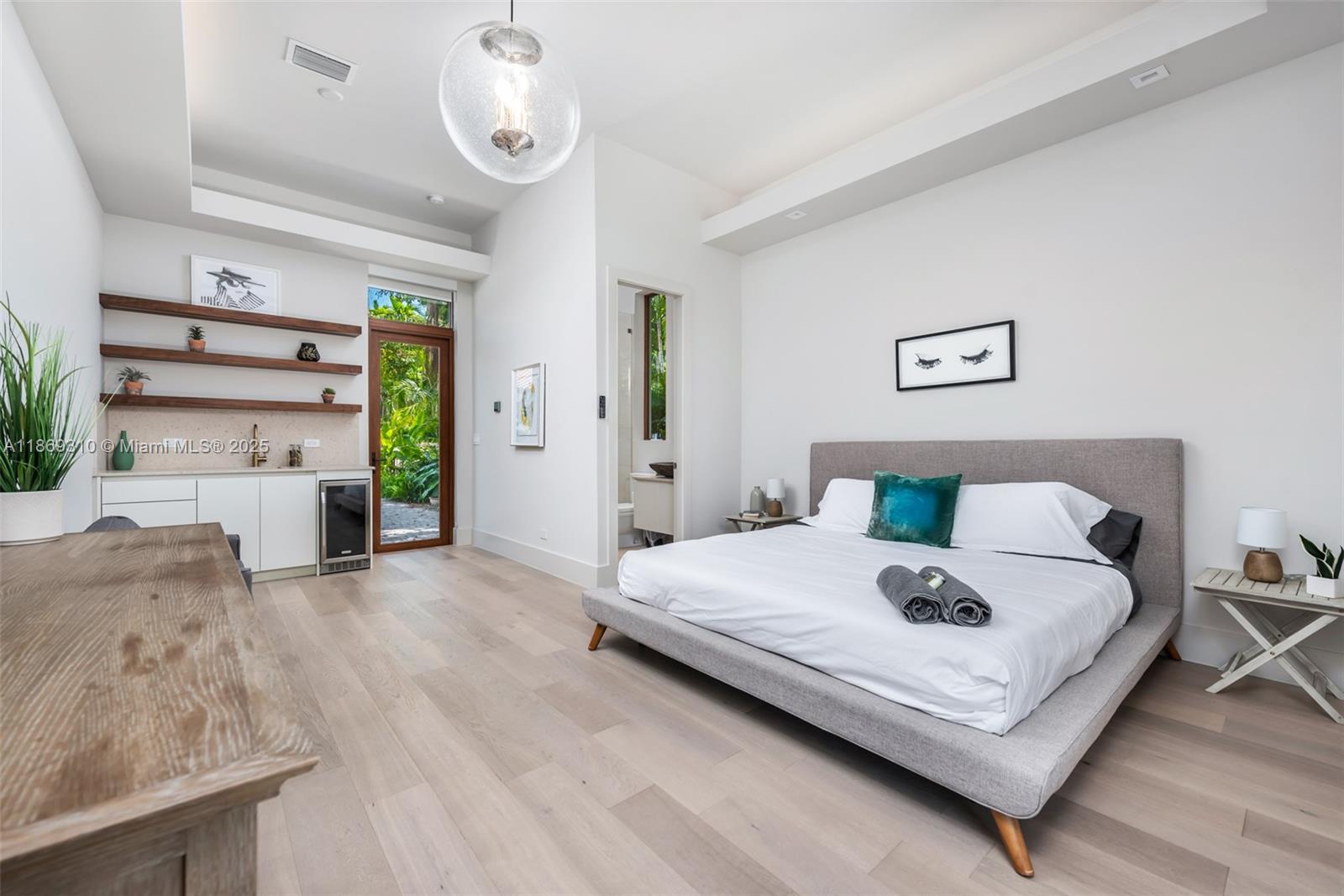 864 Northeast 84th Street Miami, FL 33138 - Photo 29 of 53 a bedroom with a bed and window