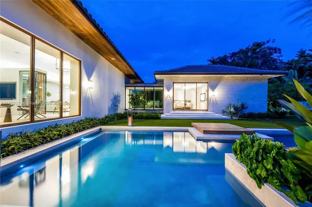 a view of a swimming pool with an outdoor seating