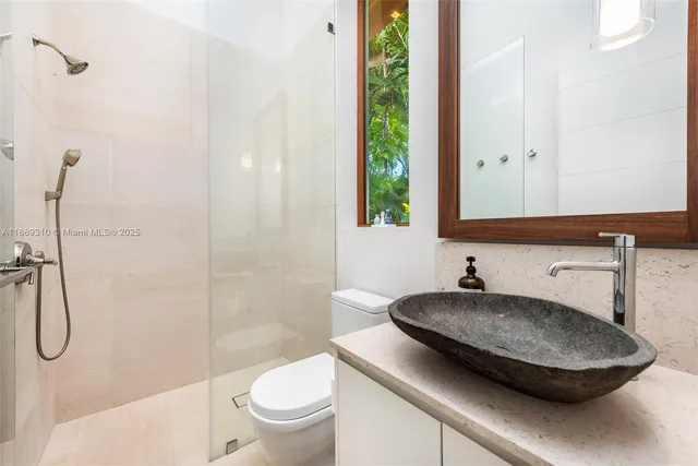 a bathroom with a double vanity sink and mirror