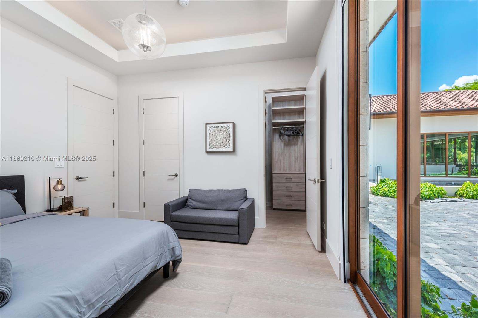 864 Northeast 84th Street Miami, FL 33138 - Photo 36 of 53 a bedroom with bed and balcony