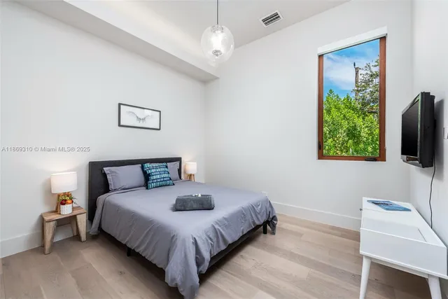 a view of entryway with bathroom and glass door