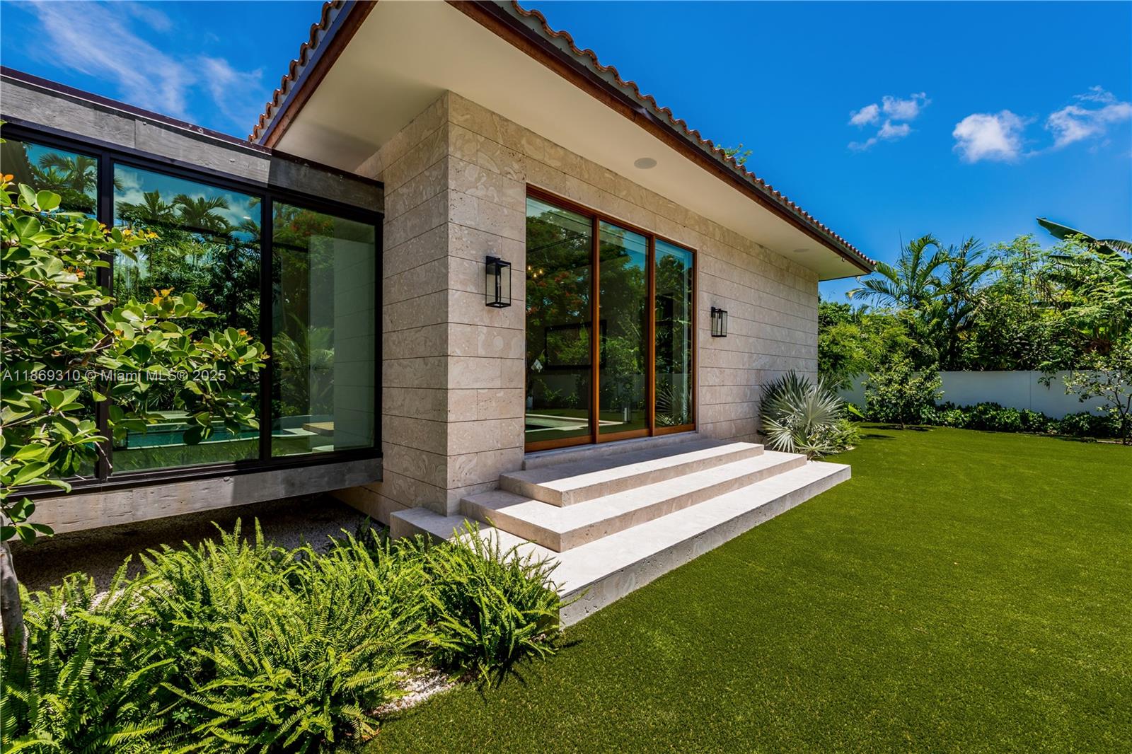 864 Northeast 84th Street Miami, FL 33138 - Photo 49 of 53 a front view of a house with a yard