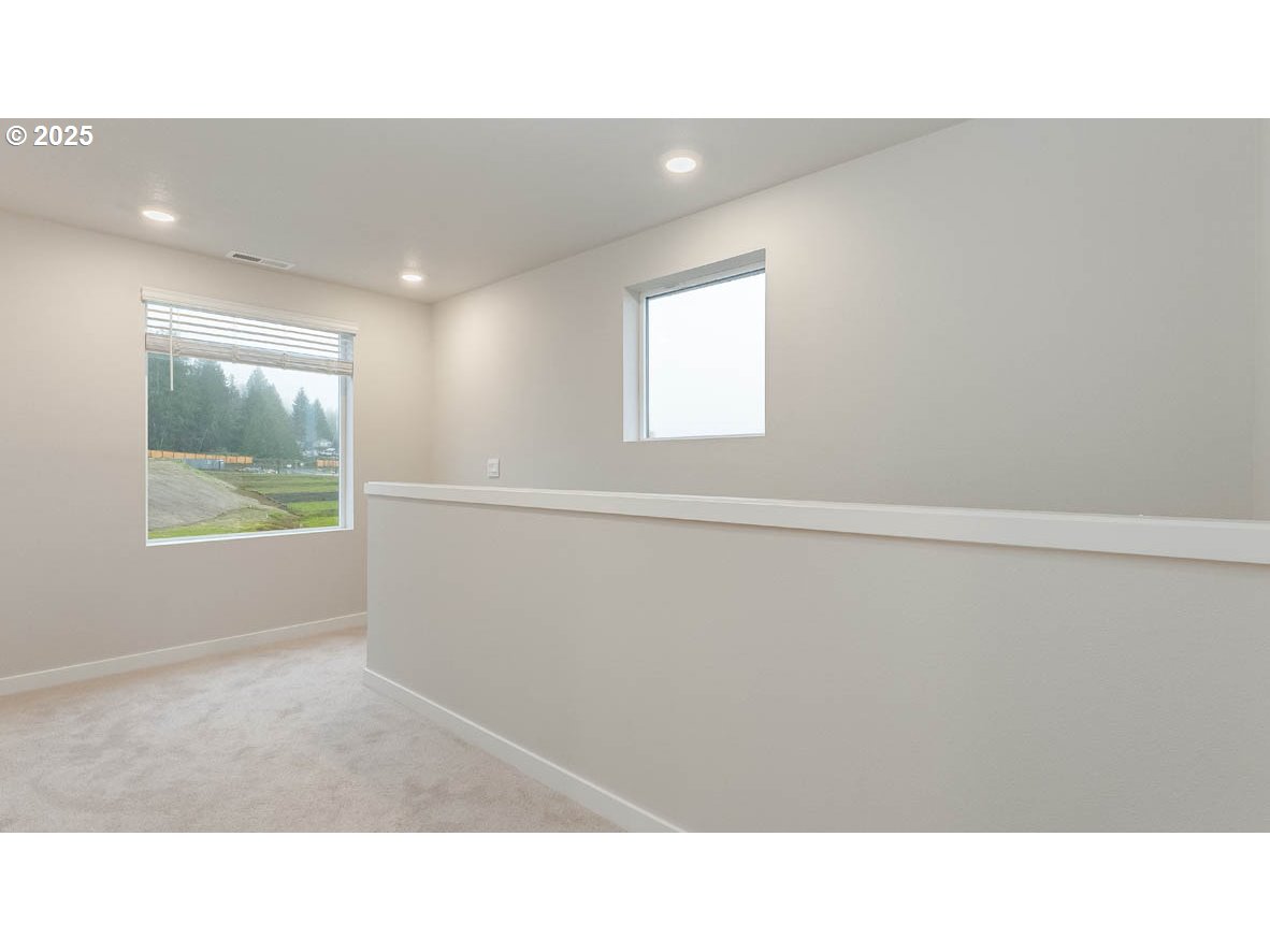 9355 Southeast Crystal Rose Street Happy Valley, OR 97086 - Photo 13 of 27 a black and white photo of a living room