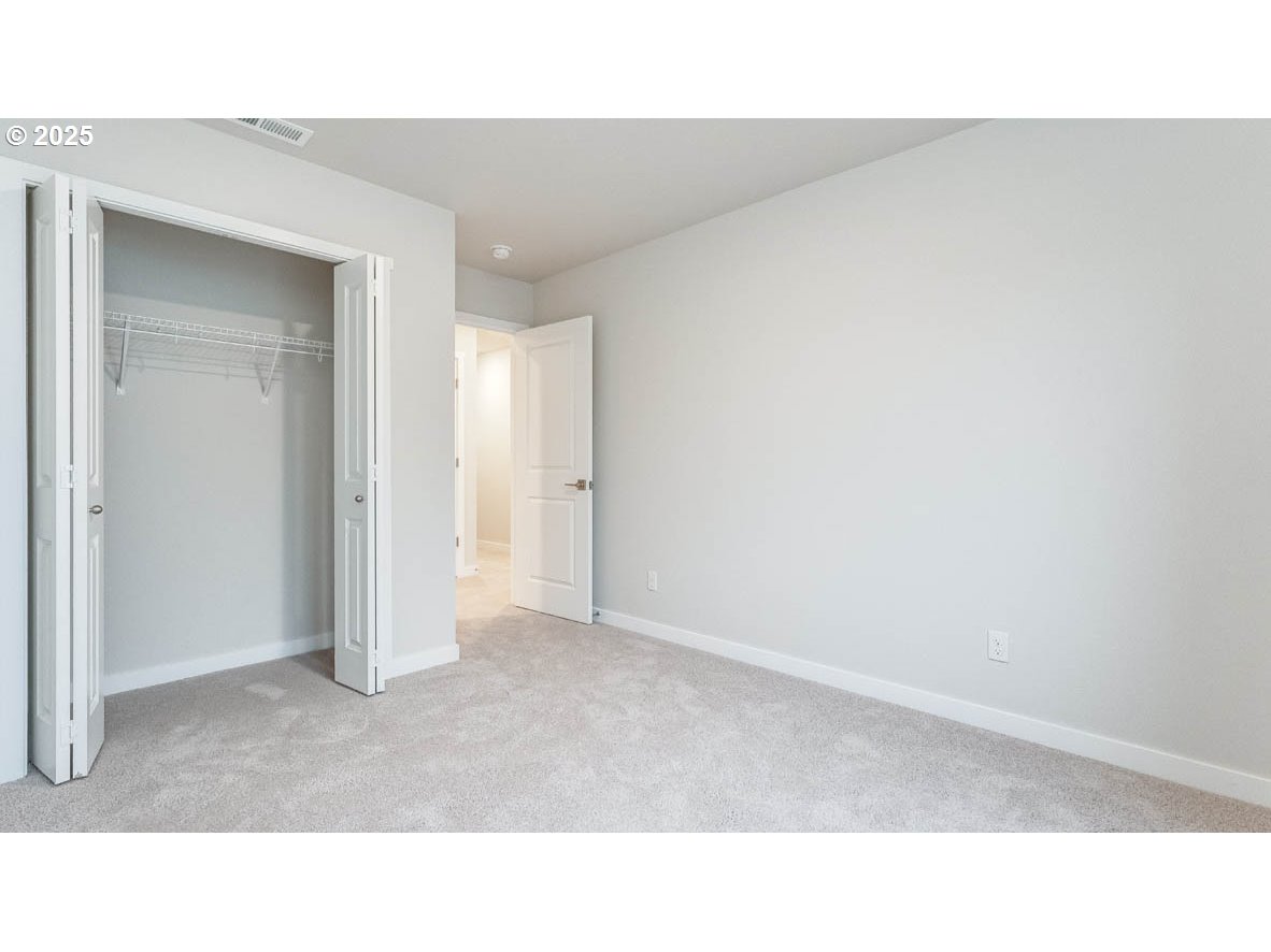 9355 Southeast Crystal Rose Street Happy Valley, OR 97086 - Photo 15 of 27 a open hall with a bench