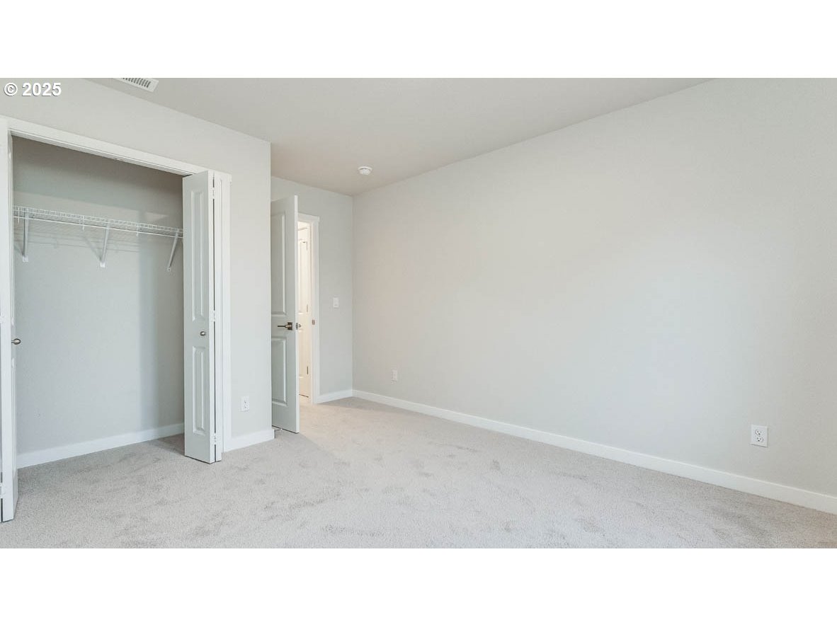 9355 Southeast Crystal Rose Street Happy Valley, OR 97086 - Photo 19 of 27 a open space with a sink and mirror