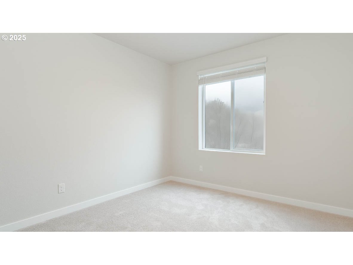 9355 Southeast Crystal Rose Street Happy Valley, OR 97086 - Photo 25 of 27 a black and white photo of a living room