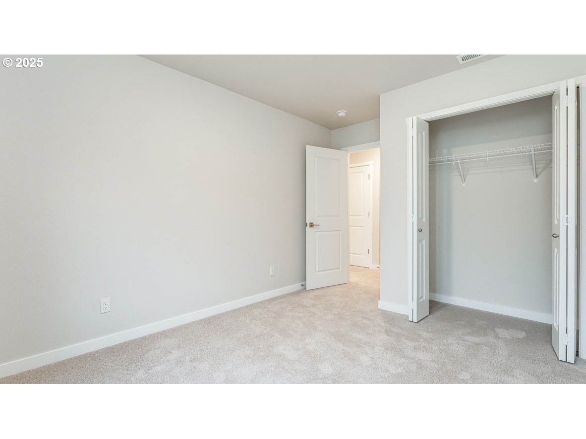 9355 Southeast Crystal Rose Street Happy Valley, OR 97086 - Photo 26 of 27 a open hall with a bench
