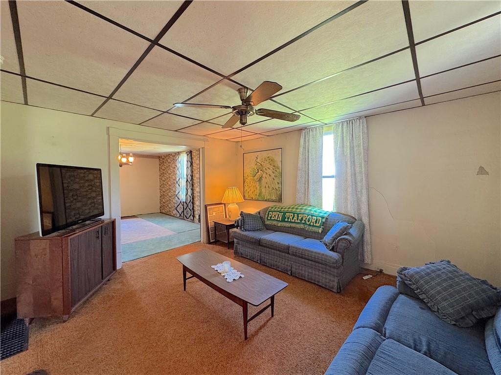 3003 Riverside Drive Claridge, PA 15623 - Photo 15 of 28 a living room with furniture and a flat screen tv