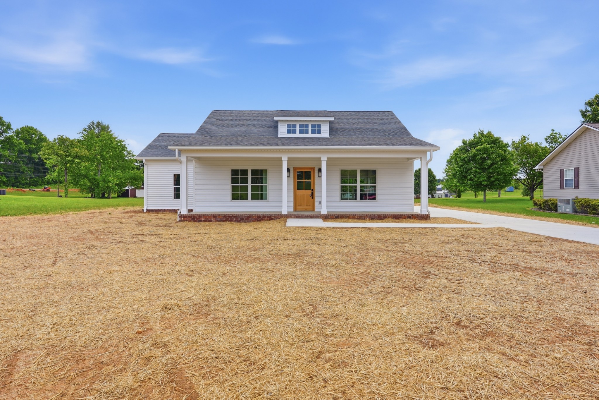 a front view of a house with a yard