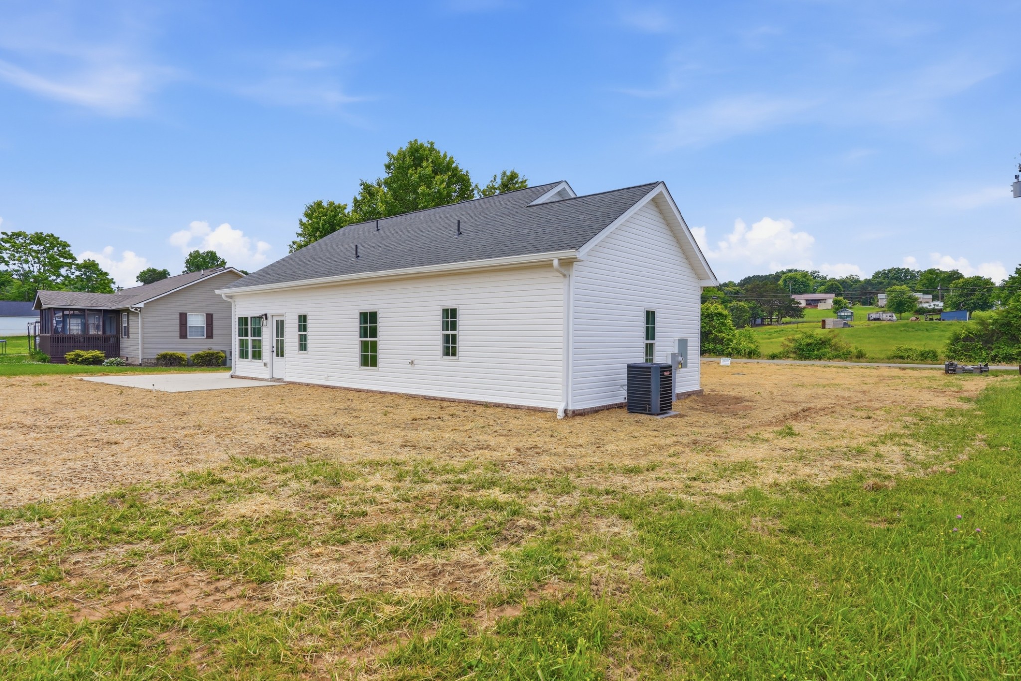 167 Fremont Road Doyle, TN 38559 - Photo 3 of 19 a front view of house with yard and trees in the background