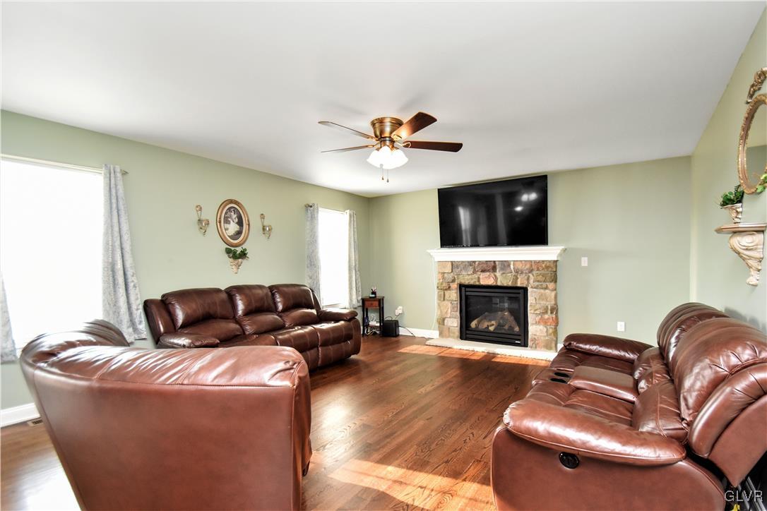 249 East Dell Road Bath, PA 18014 - Photo 16 of 50 a living room with furniture fireplace and a flat screen tv