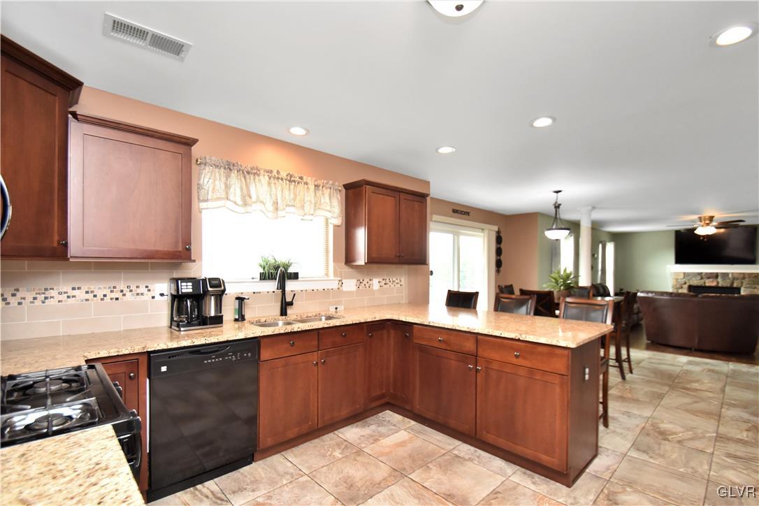 249 East Dell Road Bath, PA 18014 - Photo 22 of 50 a kitchen with a sink a window and chairs