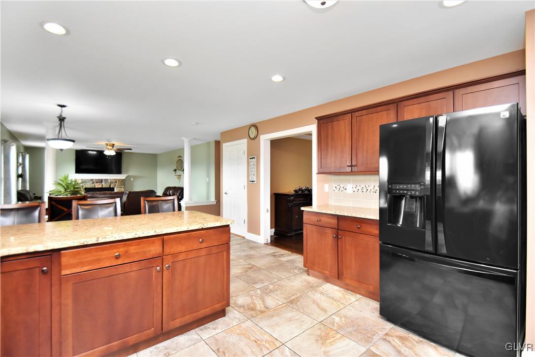 249 East Dell Road Bath, PA 18014 - Photo 23 of 50 a kitchen with stainless steel appliances granite countertop a refrigerator a stove and a sink